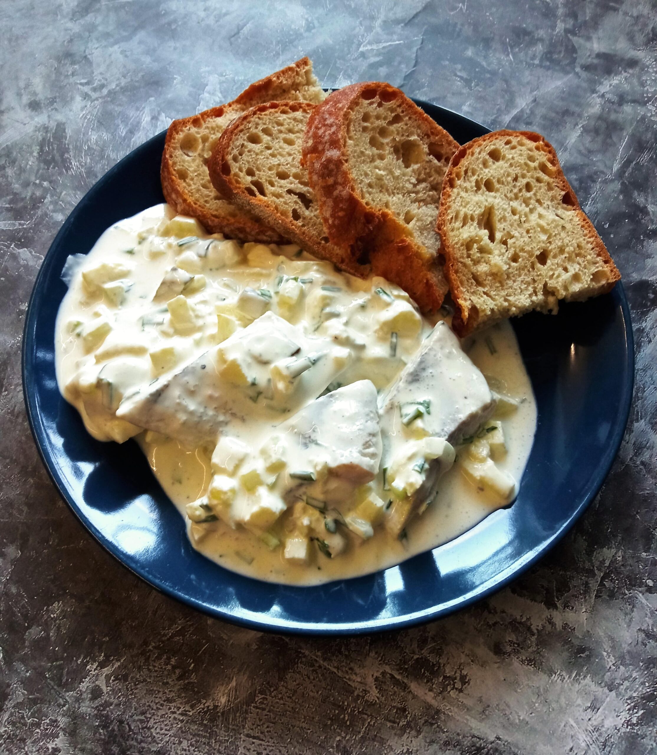 Śledzie w śmietanie